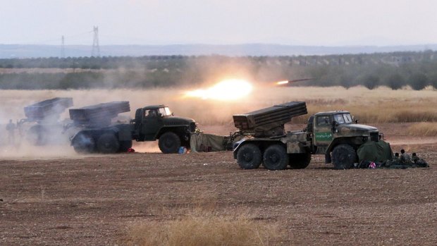 Syrian army rocket launchers fire near the village of Morek in Syria on Wednesday. 