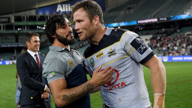 Gavin Cooper (right) says says the North Queensland Cowboys will be out to "do it" for Johnathan Thurston (left).