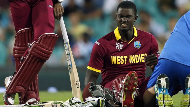 Jason Holder reacts after receiving treatment for cramps. The West Indian captain top scored with the bat and conceded the most runs with the ball.