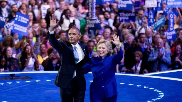 President Barack Obama and Democratic presidential candidate Hillary Clinton appear on stage together on the third day of the Democratic National Convention in Philadelphia.