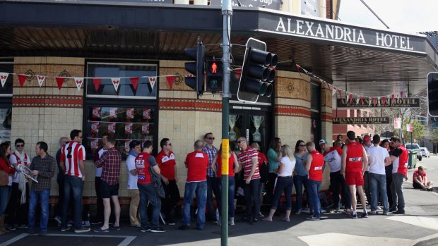 Swans fans soak up the atmosphere at the Alexandria Hotel in Sydney. 