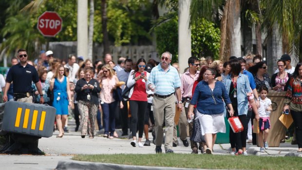 People evacuated due to a bomb threat return to the David Posnack Jewish Community Centre in Davie, Florida, last month.