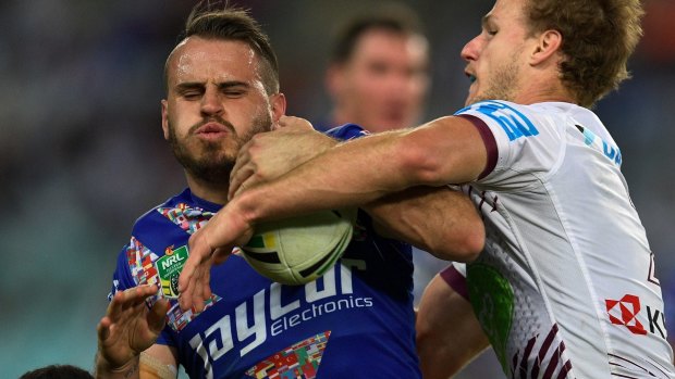 Bulldogs hero: Josh Reynolds is tackled by Daly Cherry-Evans. 