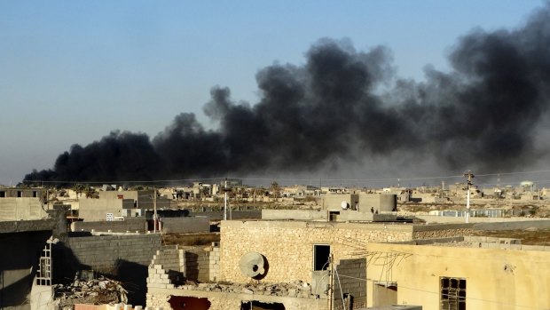 Smoke rises from Islamic State positions following a US-led coalition airstrike on Saturday.