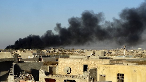 Smoke rises from Islamic State positions following a US-led coalition airstrike on Saturday.