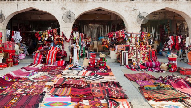 Textile shops along the street in the Souq Waqif.