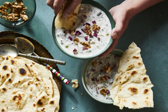 Abdoogh khiar (chilled yoghurt and cucumber soup) and noon lavash (Persian flatbread).