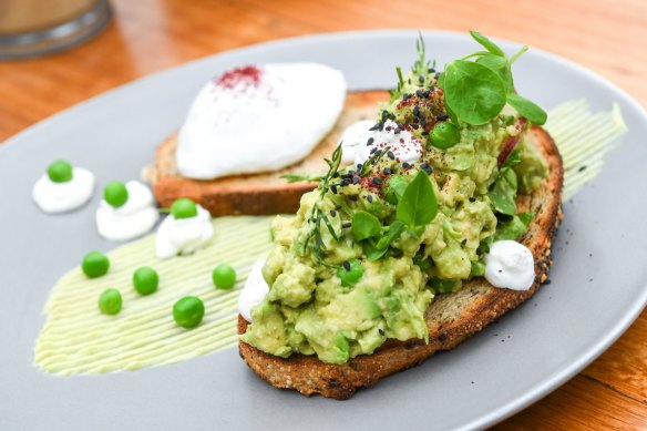 Avocado smooshed with peas and lime on sourdough.