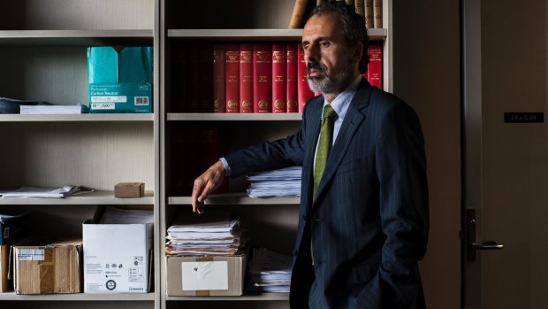 John Azzi, who has represented gay asylum seekers in court, in his office at the University of Western Sydney.