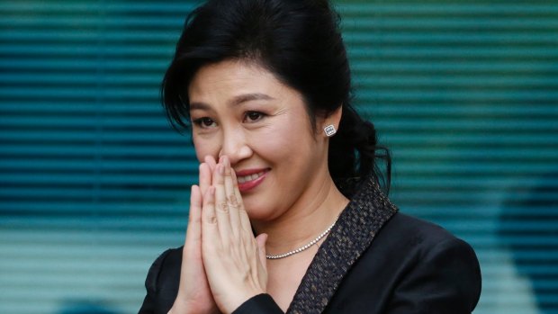 Yingluck Shinawatra thanks supporters as she arrives at the Supreme Court for her final statements on August 1. She didn't attend the hearing on Friday.