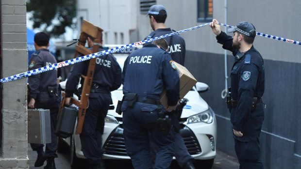 Police officers arriving at a crime scene in Surry Hills on Monday, July 30.