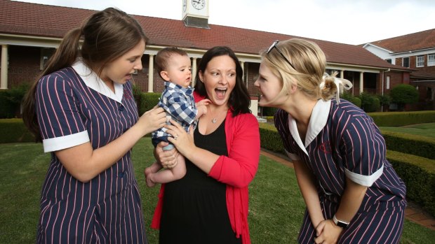 School teacher Amy Payten and her baby son James meeting her year 12  students   Olivia Whiting and Kirsten Hargreaves.