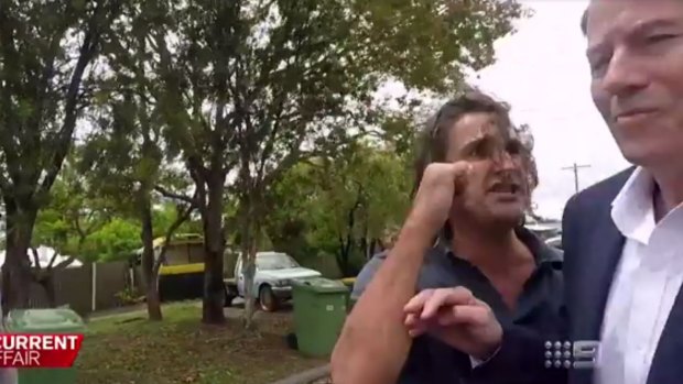 A Gold Coast man dubbed the 'neighbour from hell' attacked A Current Affair's Chris Allen.