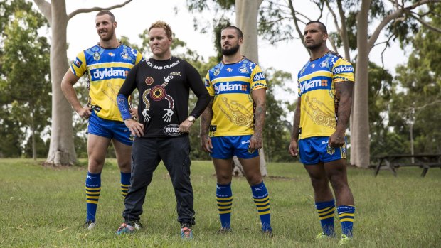 Designed with serious intent: Indigenous artist Daren Dunn with Eels players James Hasson, Nathan Peats and Manu Ma'u sporting their new jerseys.