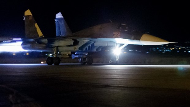 A Russian Su-34 bomber takes off on a night combat mission from Hemeimeem airbase in Syria.