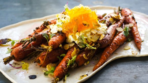 Roasted carrots with a chunk of raw honeycomb.