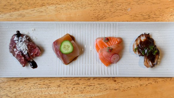 Otsumami (Japanese appetiser plate) featuring, from left, wagyu tataki with parmesan cheese, kingfish with miso sauce, salmon with salted capers and grilled octopus with spicy onion jam.