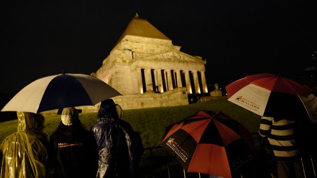 Hundreds of people gather at the Shrine of Remembrance for the ANZAC Day dawn service.