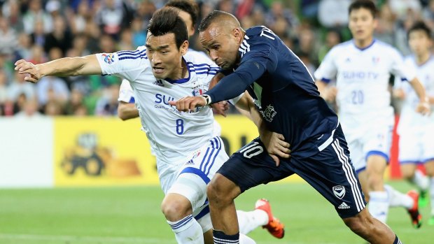 Clash: Cho Won Hee of Suwon and Archie Thompson of Victory battle for the ball last month.