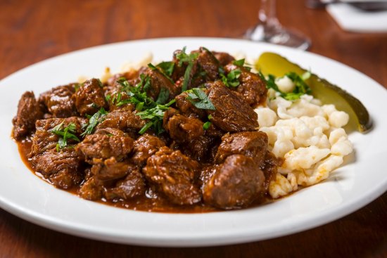 Go-to dish: Hungarian goulash with nokedli and dill pickle.