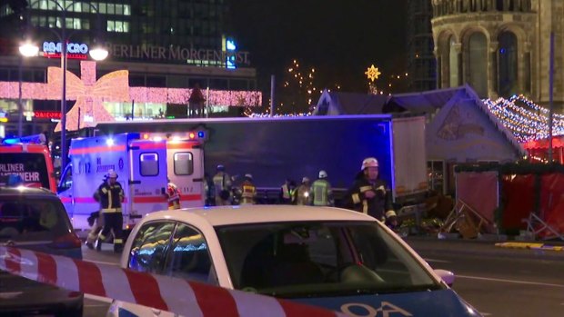 Emergency services attend the scene, after a truck ran into crowds at a Christmas market in Berlin.