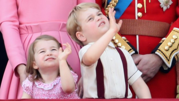 Princess Charlotte and Prince George wave from the balcony of Buckingham Palace.