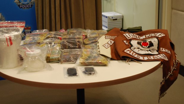 Police seized 1.3kg of methamphetamine worth $1 million, nearly $800,000 cash, a bullet-proof vest and a patched Lone Wolf gang jacket in the raids.
