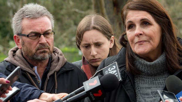 Karen's husband, Borce, their daughter, Sarah, and Karen's aunt Patricia Gray, speak to the media last year.