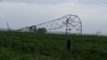 A transmission tower in South Australia is damaged following severe winds.