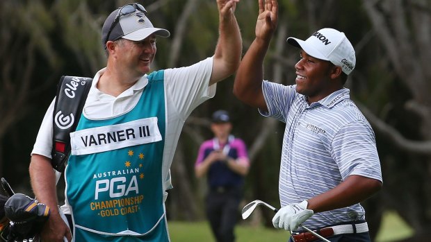 Breakthrough: Harold Varner III celebrates with his caddie on his way to winning the Australian PGA Championship in 2016.