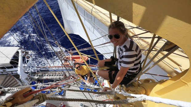 A crew member climbing the mast.