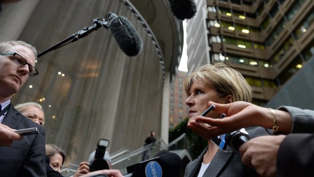 Foreign Minister Julie Bishop speaks to reporters after a tense encounter with Russian Ambassador Vladimir Morozov. 