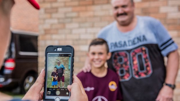 Big shot: Brohman poses with a Kurnell Stingrays junior rugby league player. "He's a happy fat man, and the kids warm to him," says his Footy Show co-host Paul Vautin.