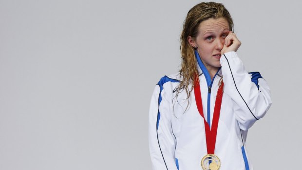 Hannah Miley fights back the tears on the podium.