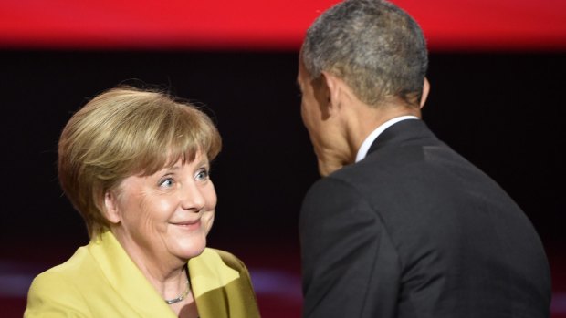 German Chancellor Angela Merkel and US President Barack Obama chat after the opening of the Hannover Messe industry fair.