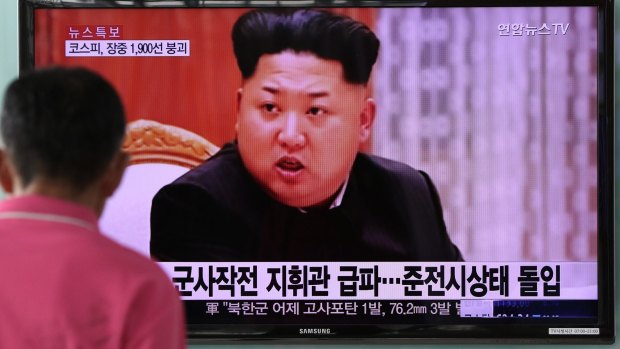 A man looks at a television screen showing an image of Kim Jong-un, leader of North Korea, in Seoul, South Korea.