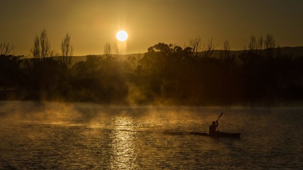 A kayaker out in the early morning on Lake Burley Griffin.
