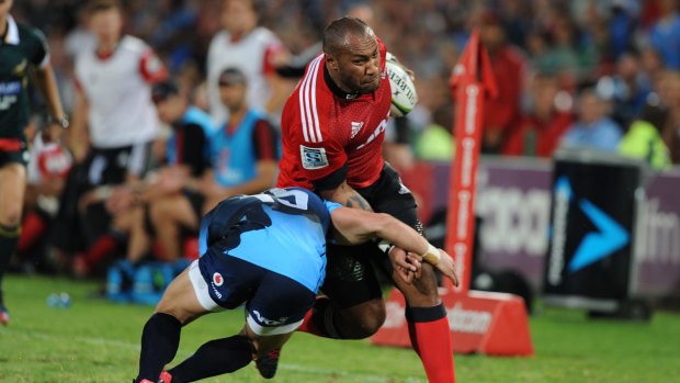 Brought down: Nemani Nadolo of Crusaders is tackled by Jesse Kriel.