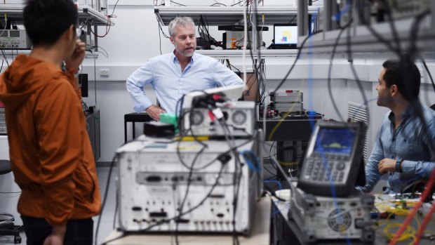 Professor Ben Eggleton (centre) in his lab at the Nanoscience Hub.