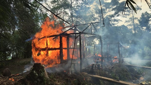 Houses on fire in Gawdu Zara village, Rakhine. Soldiers set fire to homes and shot civilians as they tried to escape, according to accounts published by human rights groups.