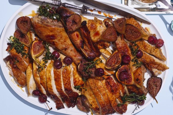 The carved turkey served with summer fruits such as cherries and figs (optional).
