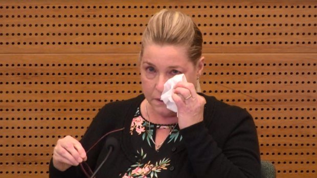 Jacqueline McDowall fights back tears in the witness box.