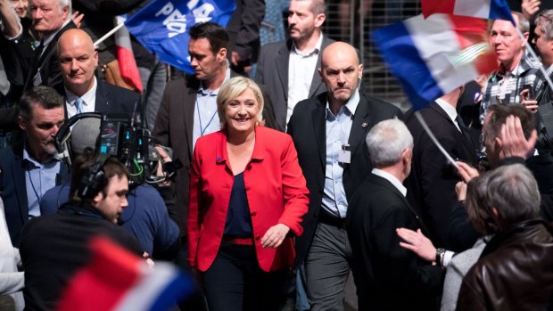 Marine Le Pen, France's presidential candidate and leader of the French National Front, arrives to speak during an election campaign meeting in Lille, France.
