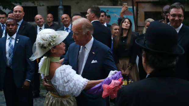 US Vice-President Joe Biden dances with street actress Ljiljana jaksic, known by her professional name Salveta, in downtown Belgrade.