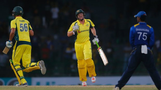 Australia's James Faulkner, centre, and Mitchell Starc complete the run to defeat Sri Lanka by three wickets.