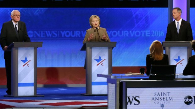 Hillary Clinton speaks between Bernie Sanders and former Maryland governor Martin O'Malley during the debate hosted by ABC News.