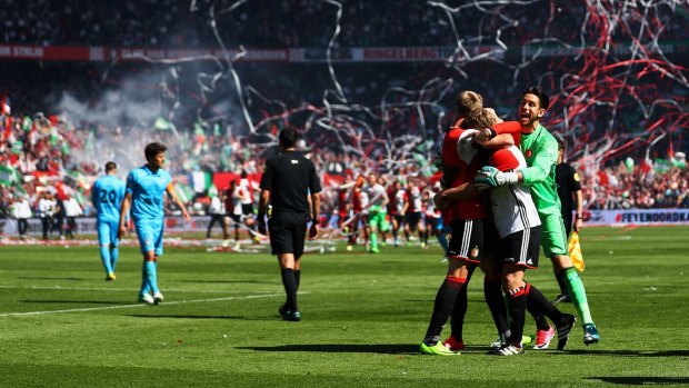 Australian Brad Jones (in green) celebrates Feyenoord's win in the Dutch Eredivisie.