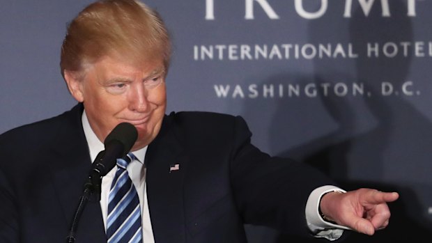 Republican presidential candidate Donald Trump speaks during the grand opening of Trump International Hotel in Washington.