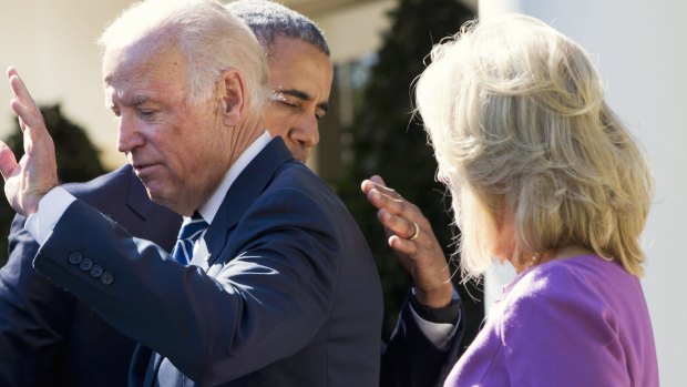 President Barack Obama hugs Vice-President Joe Biden as Mr Biden waves at the end his announcement in the Rose Garden.