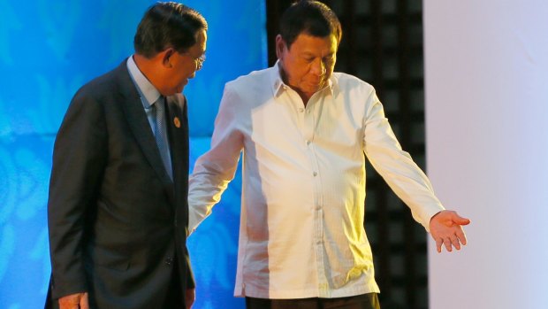 Philippine President Rodrigo Duterte, right, ushers Cambodian Prime Minister Hun Sen at the ASEAN Summit.